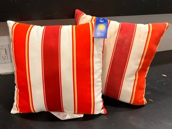 A Pair Of Striped Outdoor Throw Pillows