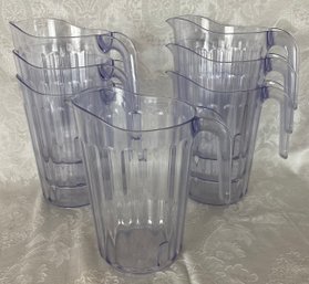 Seven Plastic Water Pitchers