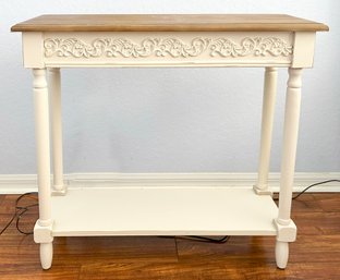 A Carved Wood Console With Natural Pine Top