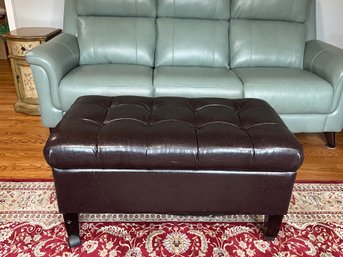 A Faux Leather Lift Top Ottoman