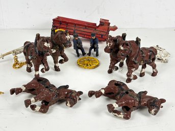 An Antique Cast Iron Coach And Horse Set