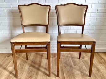 Two Wooden & Vinyl Folding Chairs