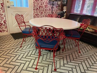 Round Dining Table With Four Cast Iron Red Painted Arm Chairs