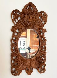 An Antique Carved Wood Balinese Mirror