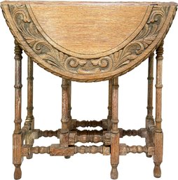 An Antique Carved Oak Gate Leg Occasional Table