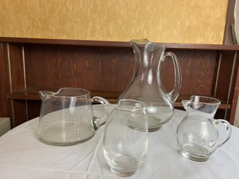 Grouping Of Four Glass Pitchers