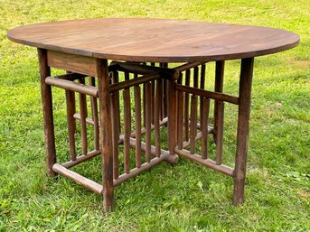 An Antique Gate Leg Table With Hewn Oak Base