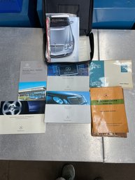 Three Various Mercedes Owner Manuals.