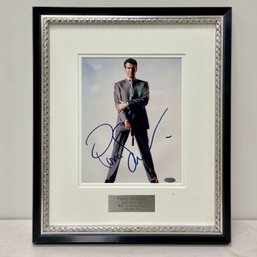 A Framed And Autographed Portrait Of Pierce Brosnan As 007