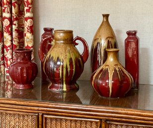 Group Of Deep Red Vases With Glazed Finish And Earth Toned Accents