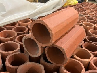 A Large Collection Of Chimney Liner Sections - Wonderful Stacked As Wine Racks!