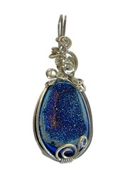 Silver Tone Wire Pendant Having Blue Rainbow Colored Mineral Specimen`