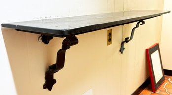 A Vintage Lacquered Wood Wall Shelf With Gothic Revival Cast Iron Brackets