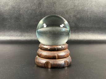 A Fun Crystal Ball On A Graduated Ring, Carved Wooden Stand