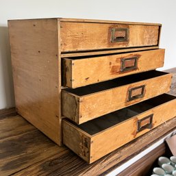 An Antique 4 Drawer Wood Table Top Chest