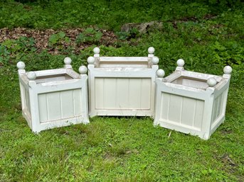 A Set Of Three Box Planters In Molded White Plastic