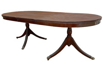 An Antique Banded Mahogany Spindle Based Extendable Dining Table, And Table Pads