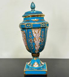 A French Sevres Lidded Urn In Gilt And Enamelled Turquoise Porcelain, 1900's