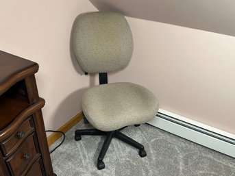 A Freeform Office Chair On Wheels