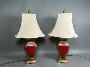A Pair Of Red & Gold Toned Lamps