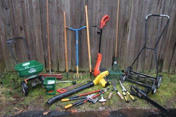 Mixed Outdoor Lot With Spreaders, Weed Wacker, Blower, Craftsman Chainsaw And Lawn Mower, Etc.