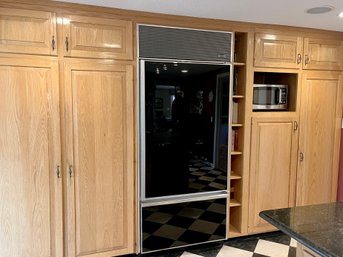 A Honey Colored Oak Kitchen Pantry Wall - Cabinets, Broom Storage & Fridge Surround