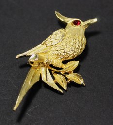 SIGNED 'BSK' GOLD TONE BIRD BROOCH RED STONE EYE