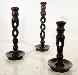 A Trio Of Hand Carved Barley Twist Candle Sticks