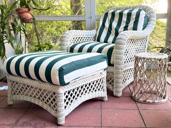 A Vintage Wicker Arm Chair, Ottoman, And Side Table