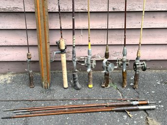 An Assortment Of Vintage Fishing Poles