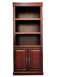 A Bookshelf With Cabinet Below