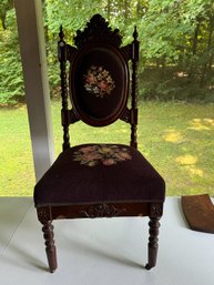 A FANCY VICTORIAN WALNUT CARVED NEEDLEPOINT CHAIR