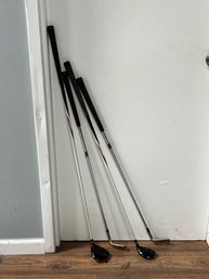 Four Golf Clubs