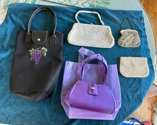 Four Beautiful Hand Bags In Multicolor And One White Purse In Different Design.