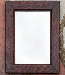 An Antique Oak Framed Mirror