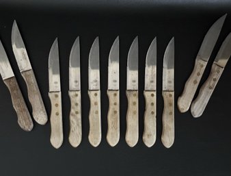 An Assortment Of Compatible Steak Knives