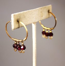 GOLD OVER SILVER HOOP PIERCED EARRINGS HAVING GARNET STONES