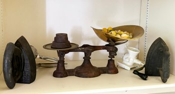 An Antique Cast Iron Scale, Irons, And Marble Fruit