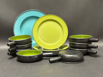 An Assortment Of Vintage Metal Dinnerware