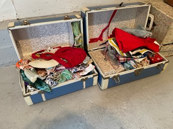 2 Cases Of Vintage Doll's Clothes.