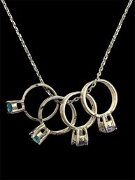 Sterling Silver Rolo Chain With Four Small Ring Pendants With Stones