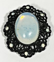 A Black Tone Oval Brooch Having Opalescent Glass Stone Signed Emmons