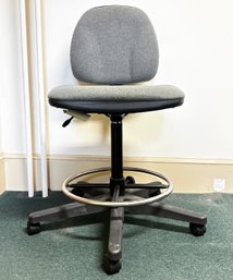 An Office Chair - Adjustable Height With Foot Rail