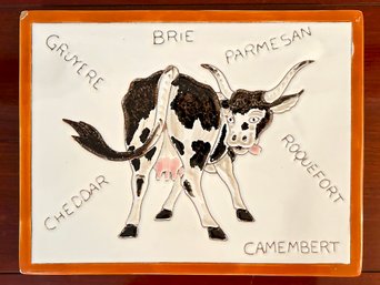 A Vintage Cow Themed Ceramic Cheese Board