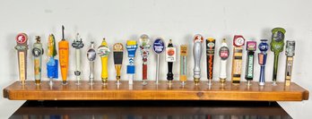 Art Beer Taps Mounted On A Pine Shelf