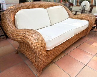 A Wicker Sofa By Pottery Barn