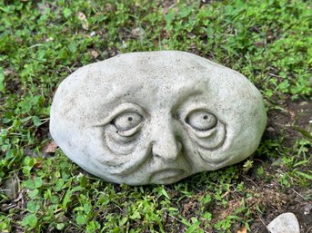 A Cast-Cement Pebble People Garden Stone