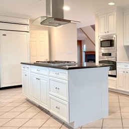 A Granite Top Kitchen Island With 5 Burner GE Gas Cooktop