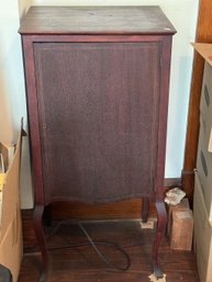 AN ANTIQUE MAHOGANY MUSIC CABINET