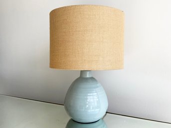 A Modern Ceramic Lamp With Linen Shade